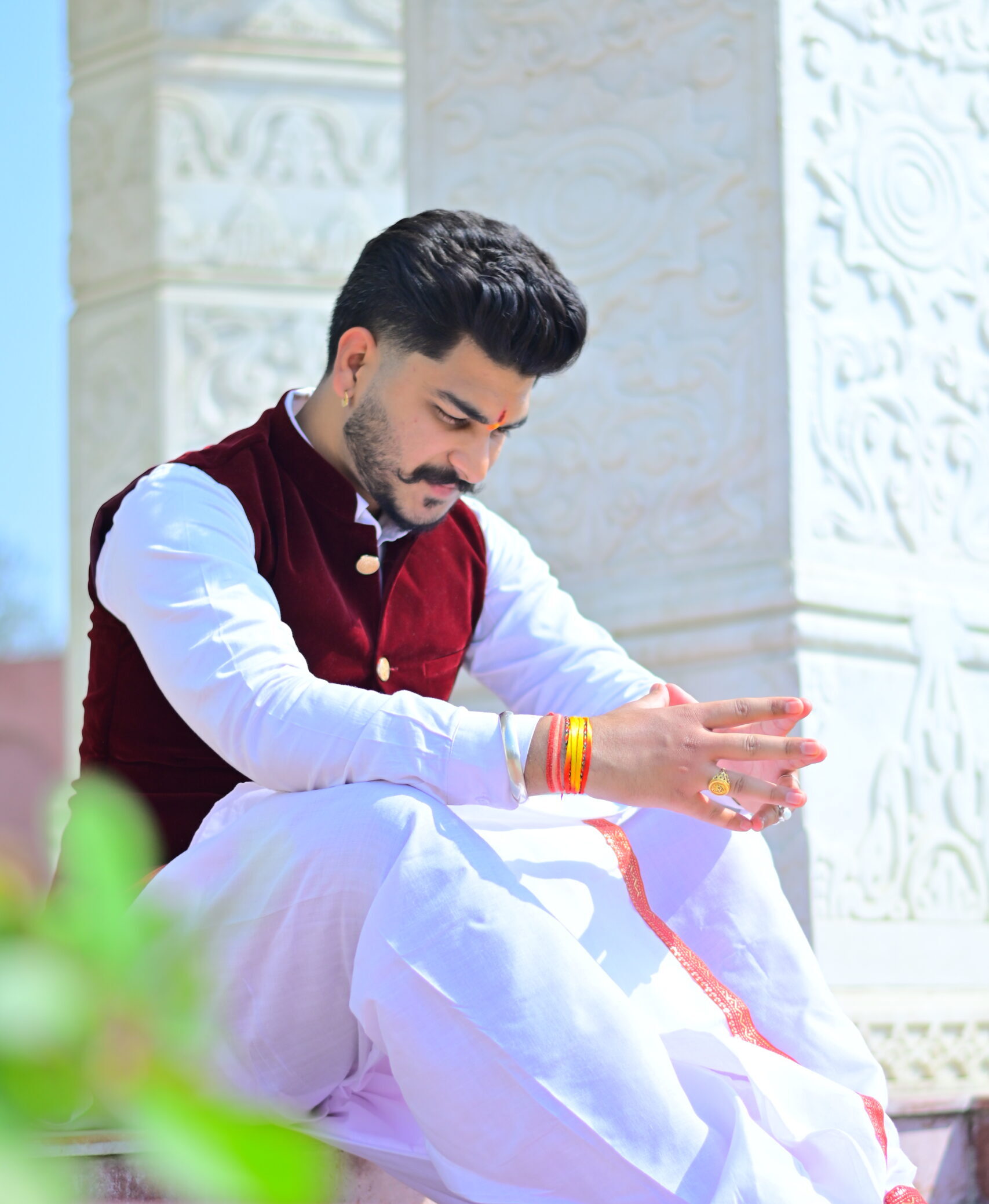 Pt. Deepak Shastri Ji sitting on stairs